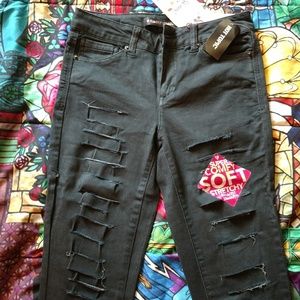 Destructed black skinny jeans